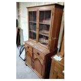 Wooden china cabinet with glass doors and storage