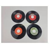 Assorted 45 RPM vinyl records with sleeves