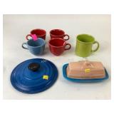 Fiesta Ware mugs and butter dish, le Creuset lid
