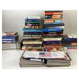 Books, magazines, DVDs, and American flag.