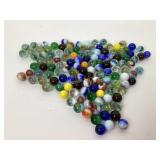 Marbles, some with fluorescent streakes