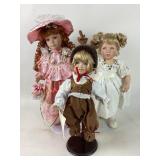 3 Porcelain dolls w/glowing eyes-one w/
