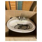 Sink with White Handles Labeled Hot & Cold 23 in.