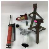 Spray paint gun, grease gun, jack stands, bottle