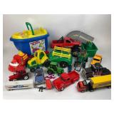 Plastic and metal toy trucks and cars