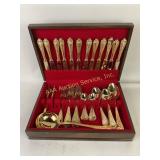 Italy gold tone flatware set in case. Marked 8