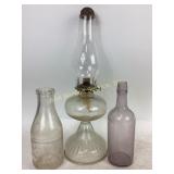 Clear glass oil lamp, Bowman dairy Company milk