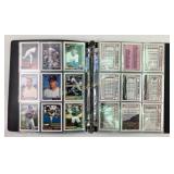 Baseball Cards organized in a binder: Roger