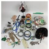 Costume jewelry: pin buttons, plastic bangles,