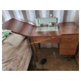 Sears Kenmore sewing machine in cabinet, some