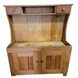 Dry sink, two doors open to shelves for storage,