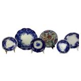 Flow Blue Plates and Saucers with Floral and Decor