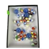 Marbles, some cracks in larger ones