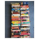 VHS tapes: gattica, magnolia, kiss the girls,