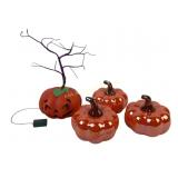 (3) iridescent orange decorative pumpkins.