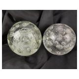 (2) Clear glass controlled bubble paperweights