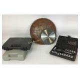 O-Ratchet sockets in case.  Saw blades.  2 empty