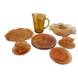 Marigold carnival glass dishes, saucers and tea