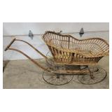 Wicker baby carriage,  some damage to front
