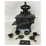 Crescent toy cast iron stove with pots and pans