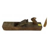 Wooden plane with horn style handle, chipped