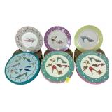 The set of 12 salad plates with shoes on them. In