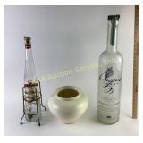 Pottery planter, large liquor bottles including