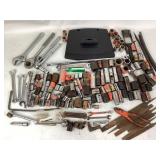 Various tools and TV stand. Tools: wrenches,