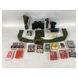 Tasco binoculars , playing cards, flashlight, dog