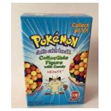 Meowth Pokï¿½mon collectible figure with candy