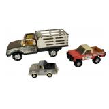 3 trucks of various scales in poor condition