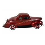 Diecast 1:18 1940 Ford Sedan model in cherry red.