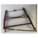 Wood carved walking stick.  Red bow buck saw
