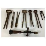 Blacksmith cast iron tools:  tongs and hand drill