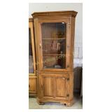 Oak lighted corner cabinet with 2 doors (1 glass,