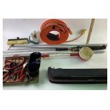 Extension cord on roll, jumper cables, new copper