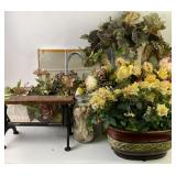 Faux flower arrangements in decorative