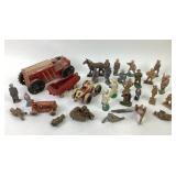 Toy lead soliders and wind-up trucks. Water