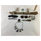 Bone like beads, buck knife in sheath, shoe horn,