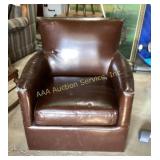 Brown leather (?) chair. 32 in tall 31 in wide x