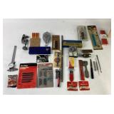 Tools: sharpening stone, utility knife blades,