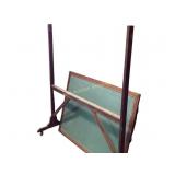 Old time chalkboard on locking caster wheels.