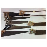 Hand saws with wooden handles, rusty