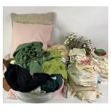 Pillows, blankets, bed linens, doilies, rug,