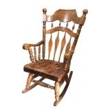 Large, heavy, wooden rocking chair. Some
