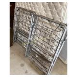 Two (2) metal cots, no cushion/mattress. Smaller