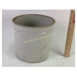 Ivory stoneware crock has crack. Good condition.