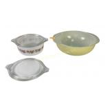 Yellow Pyrex 024 2 qt round bowl with blemish.