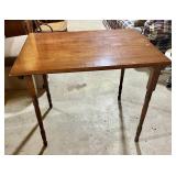 Wooden antique table with bi-folding legs. Neat
