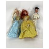 Three Fashion Dolls in Blue, Yellow, and White Gow